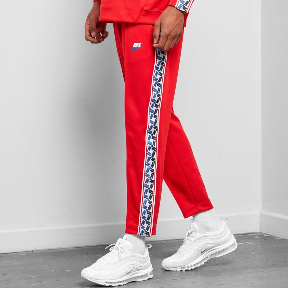 RED NIKE TAPED MONOGRAM PANTS
